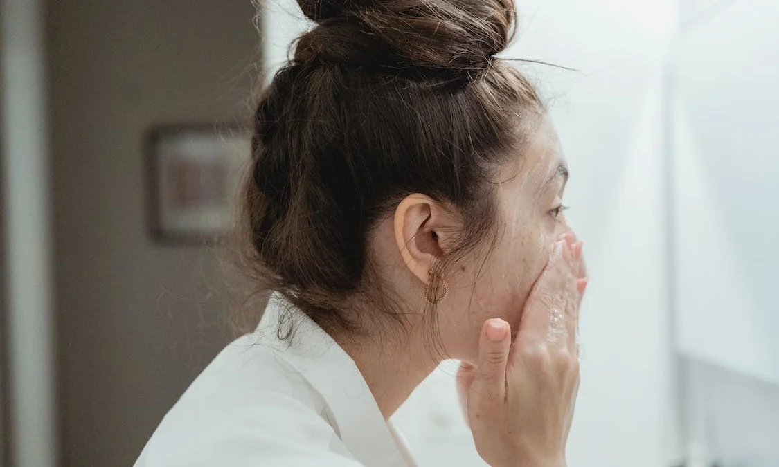 https://www.pexels.com/photo/side-view-of-woman-washing-her-face-7623581/