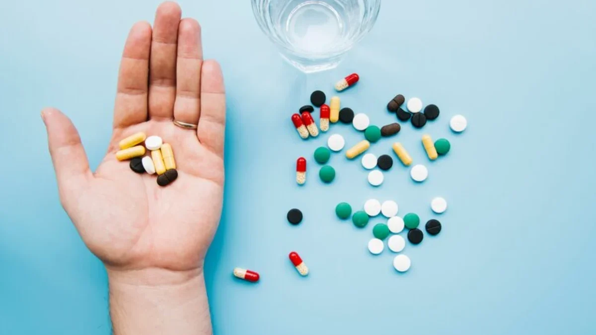 Top view hand holding pills