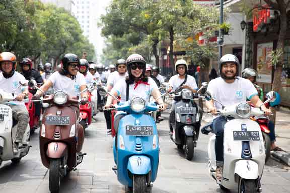 Celebration Riding Vespa