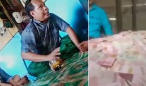 Viral, Video Tumpukan Uang Menggunung dari Dunia Ghaib, Pemilik Klaim Bisa Ubah Daun Menjadi Uang Tangkapan layar video viral, Misrawan bersama tumpukan uang menggunung yang diklaimnya dari dunia ghaib.
