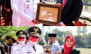 Bupati Bandung H.M Dadang Supriatna saat menyerahkan penghargaan atas inovasi pelayanan publik Perangkat Daerah (PD) di Kabupaten Bandung. Rabu (17/8). (ist)