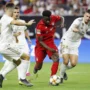 Alphonso Davies (baju merah) kala melawan Real Madrid di ICC 2019.