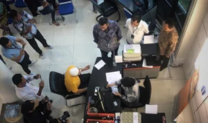 Proses pembayaran klaim penjaminan simpanan nasabah oleh LPS. (Dok Humas Kantor LPS)