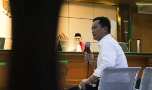 Sidang Bandung Smart City, Ema Sumarna Ngaku Tak Ada Perintah Uang Atensi kepada Dishub Bandung Ist. Sekda Kota Bandung Ema Sumarna saat dihadirkan sebagai saksi dalam sidang kasus suap Bandung Smart City. Jum'at (10/8). Foto. Pandu Muslim Jabar Ekspres.