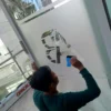 Pemasangan stiker kaca di perkantoran wilayah Yogyakarta dari Aselole Stiker.