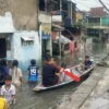 Banjir di Kampung Bojong Asih, Kecamatan Dayeuhkolot, Kabupaten Bandung ketinggian air bervariasi mulai dari 30 sentimeter hingga 150 sentimeter. Foto Agi