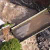Foto udara Jembatan Putus di Jalan Hamkam, Cisarua, Kabupaten Bogor. Foto : Sandika /Jabarekspres.com