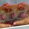 Uang Rupiah foto ilustrasi bansos PKH dan BPNT 2025.