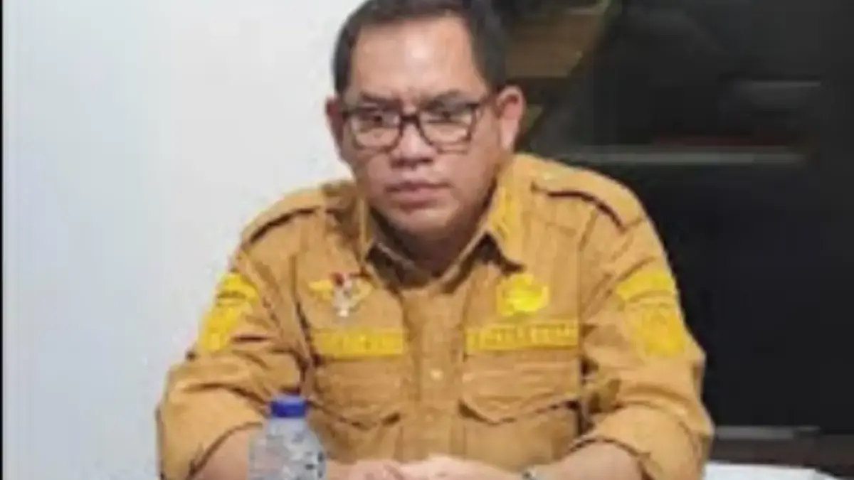 Kades Cikuda, Kecamatan Parung Panjang, Kabupaten Bogor, R Agus Sutisna (RAS) yang ditangkap karena diduga mel