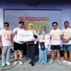 gelaran The Unstoppable AIvolusi5G Run di Kiara Artha Park, Minggu (15/2/2026). 