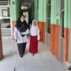 Lulu Imas Fufah, seorang aparatur sipil negara (ASN) yang mengajar mata pelajaran Guru Kelas di MIN 1 Kota Ban