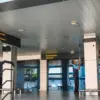 Petugas membersihkan kaca di pintu kedatangan domestik Bandara Internasional Husein Sastranegara, Kota Bandu
