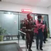 Kepala Badan Kesatuan dan Politik (Bakesbangpol) Kabupaten Sumedang, Asep Tatang (AT) saat keluar dari gedung
