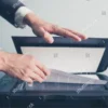 scanner (https://www.shutterstock.com/image-photo/hands-young-businessman-placing-document-on-264387707)